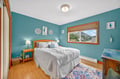 Drift off peacefully in your coastal-themed bedroom, where calming turquoise walls and charming seahorse decor create your own seaside sanctuary.