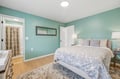 Sink into plush bedding surrounded by soothing coastal tones. Your private retreat features soft lighting, an ensuite bathroom, and calming décor that invites restful sleep after a day of adventure.