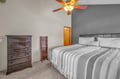 Drift off in your peaceful bedroom with crisp linens, ample storage, and gentle ceiling fan breezes for ultimate comfort.