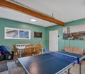 Game Room: Additional game room view with ping pong and seating.