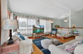 Sink into plush seating and unwind in your spacious living room, complete with flat-screen TV and charming nautical touches throughout.