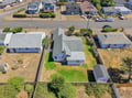 An aerial view of the property and its residential neighborhood setting, showing the home's location within the surrounding area.