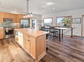Gather around your spacious kitchen island while natural light streams through panoramic windows, creating the perfect space for cooking and conversation.