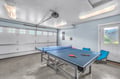 Challenge friends to ping pong matches in your private game room, complete with seating for spectators and mountain views.