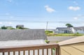 Coastal neighborhood view showcasing charming residential homes and peaceful streets in this seaside community setting.