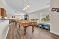 Challenge friends to pool while enjoying mountain views through expansive windows in this open-concept entertainment space.