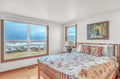Wake up to breathtaking ocean views from your comfortable bed, where waves crash just beyond your window.