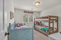 Your kids will love this cheerful bedroom with colorful bedding and fun superhero themes that make bedtime an adventure.