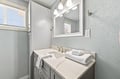 Refresh in your bright, modern bathroom with fresh towels, soft lighting, and a spacious vanity—a serene space designed just for you.