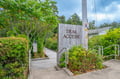 A dedicated trail access point marks the entrance to scenic walking paths just beyond the property, inviting exploration of the natural landscape and nearby outdoor adventures.