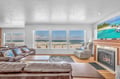 Unwind in your oceanfront living room where crashing waves create the perfect soundtrack to cozy evenings by the fireplace.