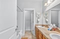 Unwind in your spacious bathroom with dual sinks, deep soaking tub, and separate shower for ultimate convenience.