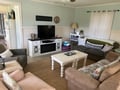 Sink into soft sofas and unwind in this peaceful living room, where you can gather with loved ones around the TV.