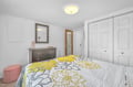 Your bright bedroom offers cheerful yellow and gray florals, plenty of closet space, and cozy seating for relaxing.