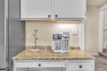 Your private coffee station awaits with premium granite counters and modern appliances for perfect morning brews.