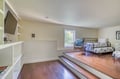 Unwind in your spacious bedroom with elevated sleeping area, built-in shelving for all your belongings, and a cozy wicker chair by the sunlit window—your peaceful retreat awaits.