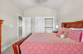 Drift into peaceful sleep in your cozy bedroom, featuring warm wood furnishings and plenty of closet space for all your belongings.