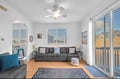 Sink into the plush sofa and enjoy the airy comfort of this bright, open living space. Natural light spills through multiple windows and glass doors, creating a peaceful retreat to unwind after your adventures.