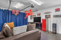 Kick back in your own game room hangout with a fun, retro vibe—think hanging basketball hoop, bold décor, and plenty of space to relax with family or friends.