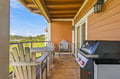 Private balcony overlooking lush green fields and rolling hills. Fire up the grill, settle into an Adirondack chair, and let the peaceful scenery melt your worries away.