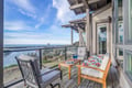 Savor breathtaking ocean views from your private deck, where comfortable seating awaits your morning coffee and evening relaxation.