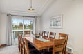 Gather around your elegant dining table for memorable meals, with warm wood tones and scenic views creating the perfect backdrop for every occasion.