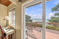 Your desk by the window becomes the perfect spot to sip coffee and watch the waves. Natural light streams through French doors leading to your private deck, where ocean breezes and the sound of the surf create your ideal coastal escape.