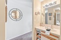Freshen up in your well-lit bathroom with ample vanity space and convenient storage for all your toiletries and essentials.