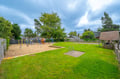 The property's shared outdoor space features a children's playground with swings and slides, plus a playhouse—perfect for families looking to keep little ones entertained during their stay.