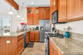 Cook memorable meals in your spacious kitchen with granite counters, stainless appliances, and warm wood cabinets.