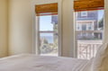 Wake up to soft ocean breezes and shimmering sea views through your windows, framed by warm bamboo shades that invite gentle morning light into your peaceful retreat.