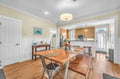Your open-concept dining and kitchen space features warm wood floors, coastal décor, and everything you need for memorable meals together.