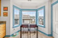 Your charming breakfast nook features a bright bay window where you'll enjoy morning coffee while watching the neighborhood come alive.