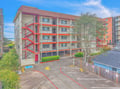 Multi-story building with convenient parking located in a vibrant beachside community with easy access to surrounding amenities.