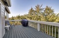 Your private deck overlooks peaceful trees with seating and covered grill for memorable outdoor meals.