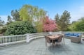 Step onto your private terrace where morning coffee and evening dinners await, surrounded by blooming trees and peaceful garden views.