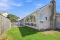 Charming pink cottage with a private grassed yard and white picket fence—your sunny, character-filled retreat in a peaceful neighborhood.