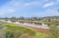 Peaceful riverside location with serene water views and surrounding natural landscape near the property.