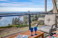 Sip your morning coffee while gazing at the stunning ocean vista from your private balcony, complete with comfortable seating and breathtaking coastal views.