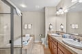 Your spacious bathroom features dual vanities, soaking tub, and separate shower—perfect for relaxing after your adventures.