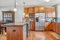 Your fully equipped kitchen features warm wood cabinets, granite counters, and stainless appliances - perfect for preparing memorable meals together.