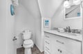Your private bathroom features elegant marble countertops and thoughtful coastal touches that make freshening up feel like a spa retreat.