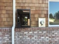 Distinctive cedar shake exterior blends traditional charm with modern design elements for an inviting arrival experience.
