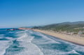 Stunning coastal vista showcasing pristine beaches and rolling waves along the scenic shoreline.