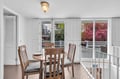 Your elegant dining space flows seamlessly to the private balcony through French doors, where morning coffee and evening meals feel extra special.