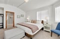 Your serene bedroom features a king bed, cozy seating, and private bathroom access for complete comfort.