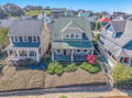 Charming coastal cottage nestled in a picturesque neighborhood of colorful beach houses, offering authentic seaside charm.