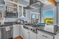 Your gourmet kitchen awaits with granite counters, stainless appliances, and natural light streaming through windows.