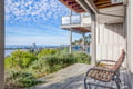 Stunning coastal panorama unfolds from this elevated deck overlooking the Pacific coastline and Haystack Rock.