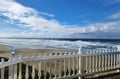 Wide sandy shore meets rolling waves beneath sweeping coastal skies—a serene beachfront setting perfect for morning strolls or simply soaking in the ocean breeze.